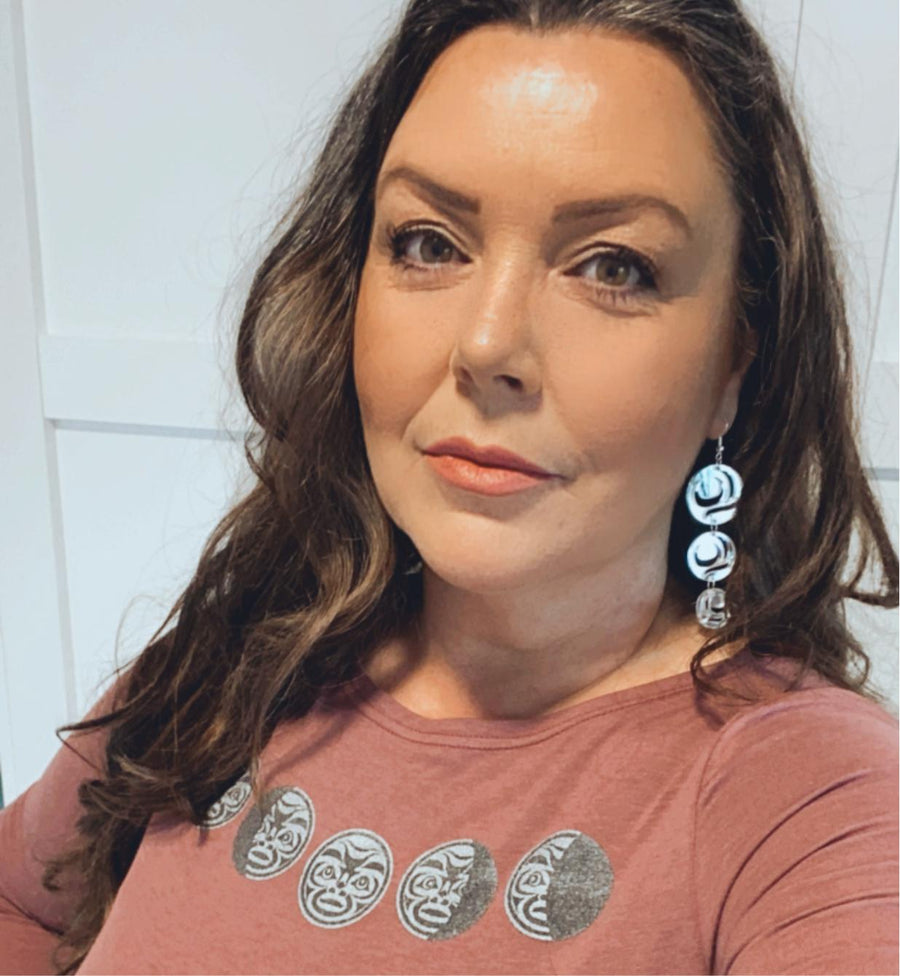 Model wearing earrings Moon Drops by indigenous artist acrylic 4