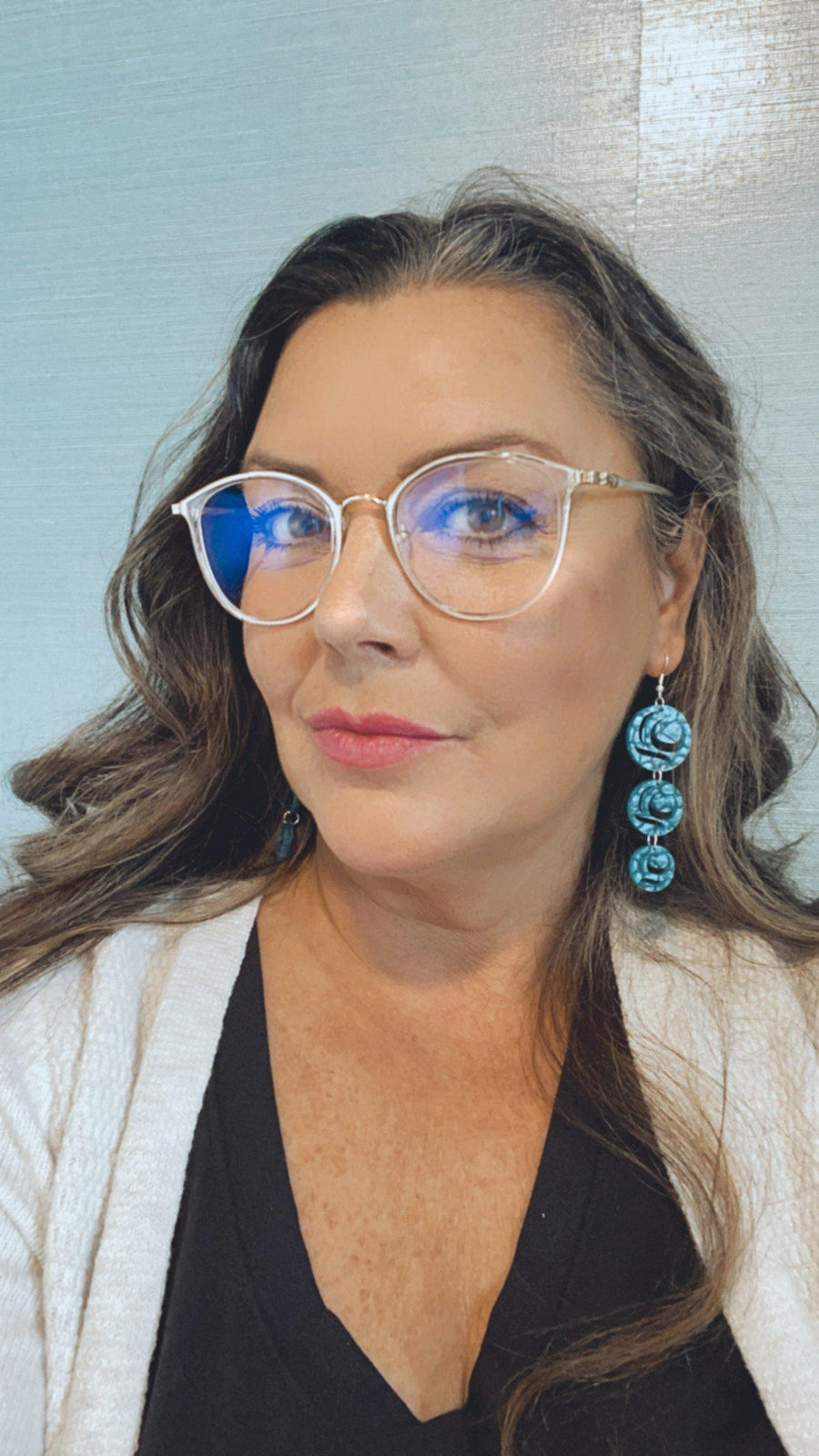 Model wearing earrings Moon Drops by indigenous artist acrylic 5