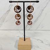 Close up of earrings Moon Drops by indigenous artist acrylic 3