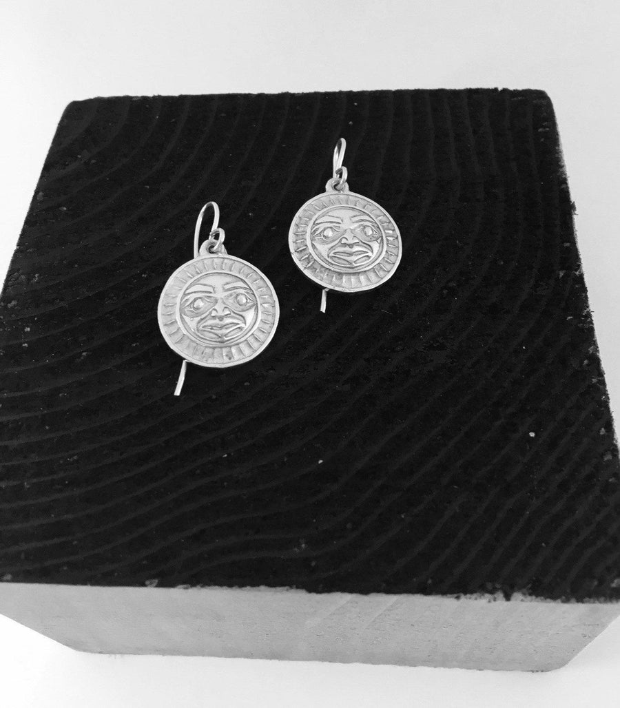 Close up of earrings silver moon or sun by indigenous artist 5