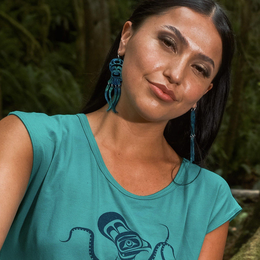 Model wearing octopus earrings by indigenous artist acrylic