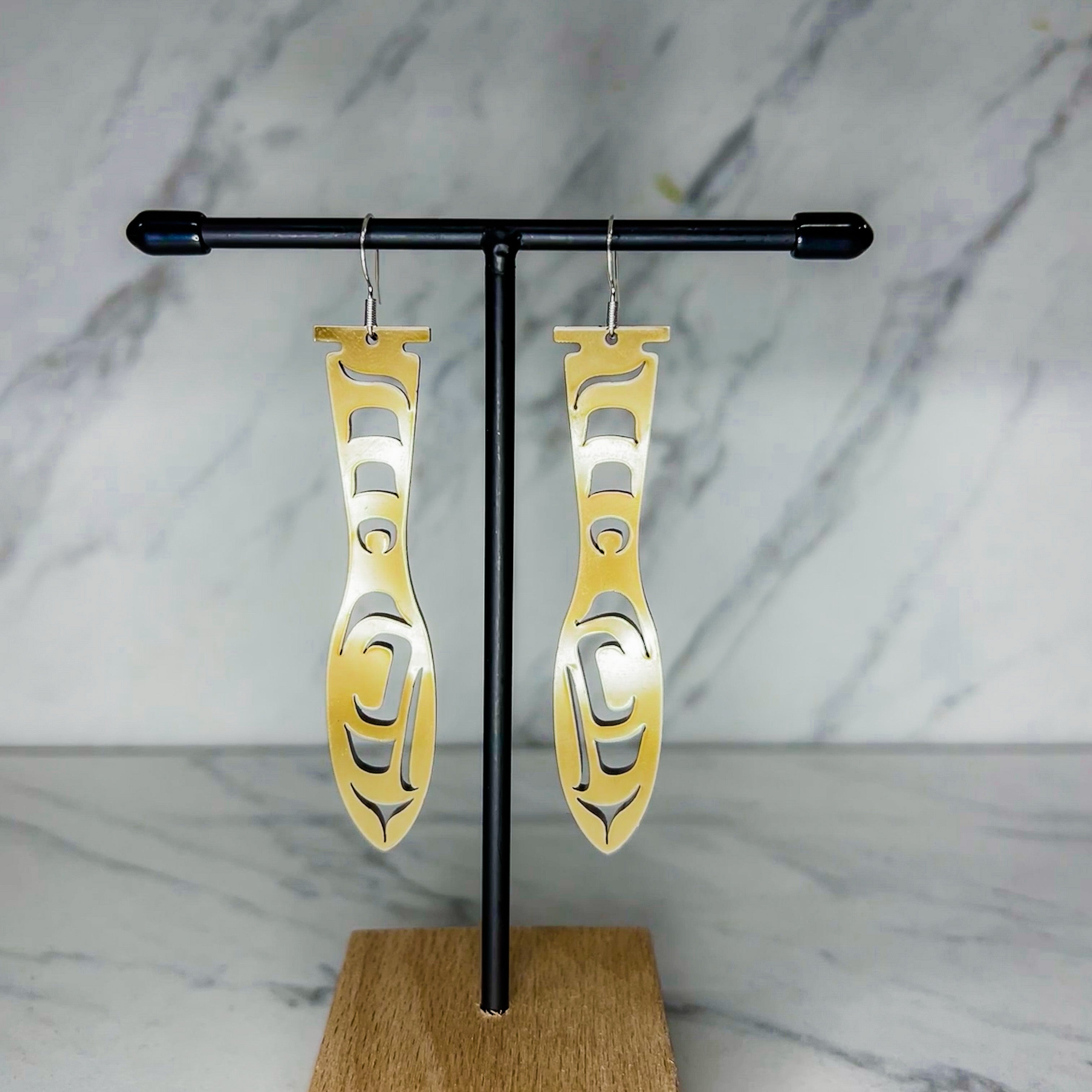 Close up of paddle acrylic and abalone earrings by indigenous artist 2