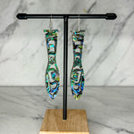 Close up of paddle acrylic and abalone earrings by indigenous artist 3