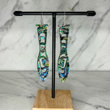 Close up of paddle acrylic and abalone earrings by indigenous artist 3