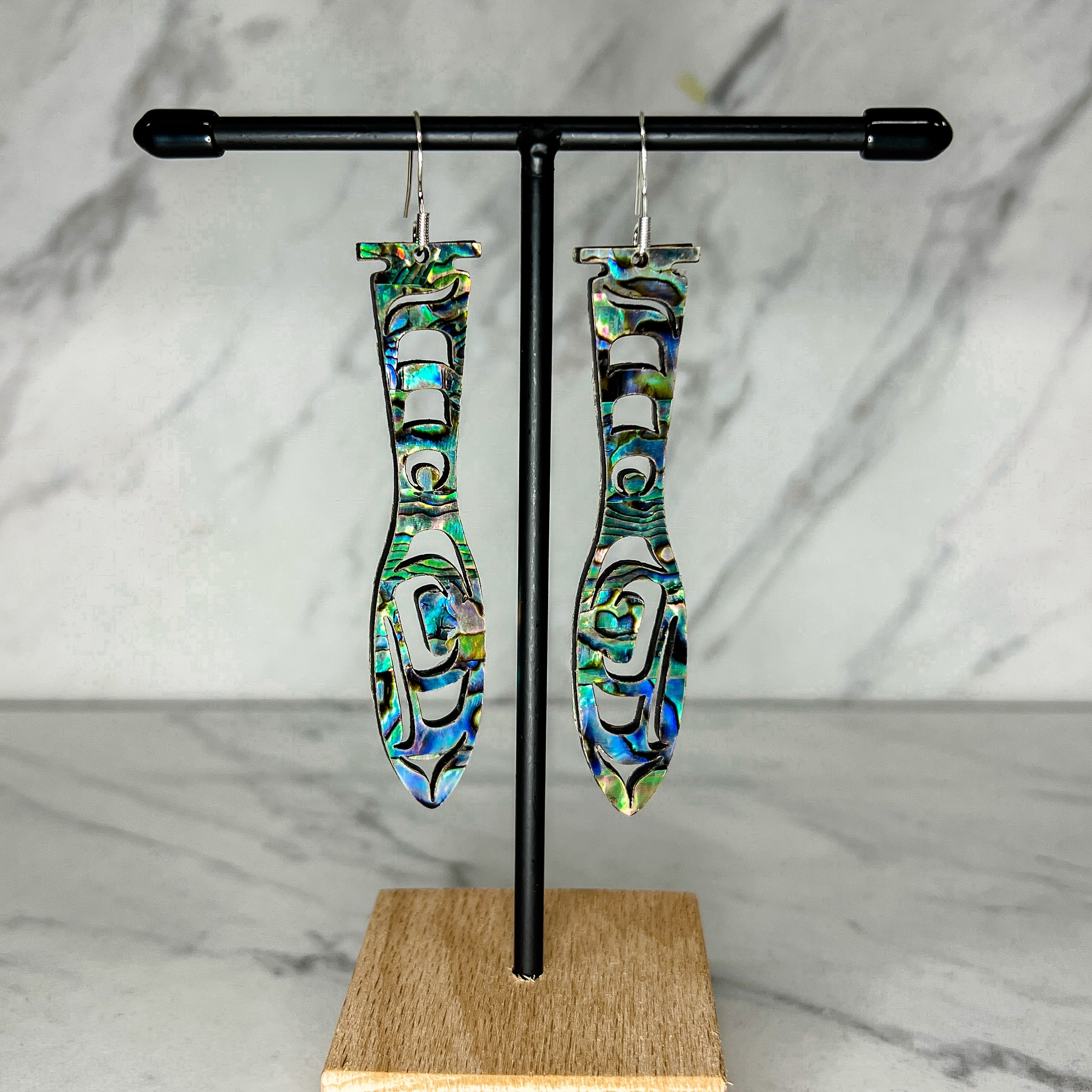 Close up of paddle acrylic and abalone earrings by indigenous artist 3