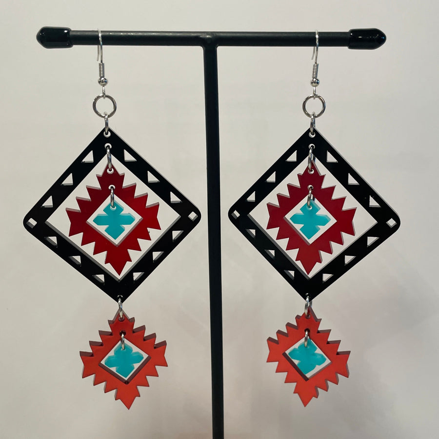Close up up of plains points earrings by indigenous artist acrylic 4