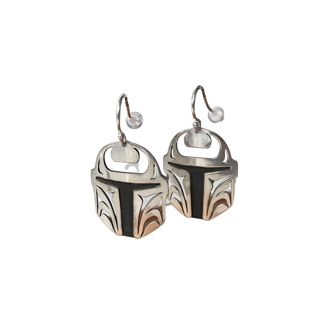 Close up of Protector earrings by indigenous artist sterling silver