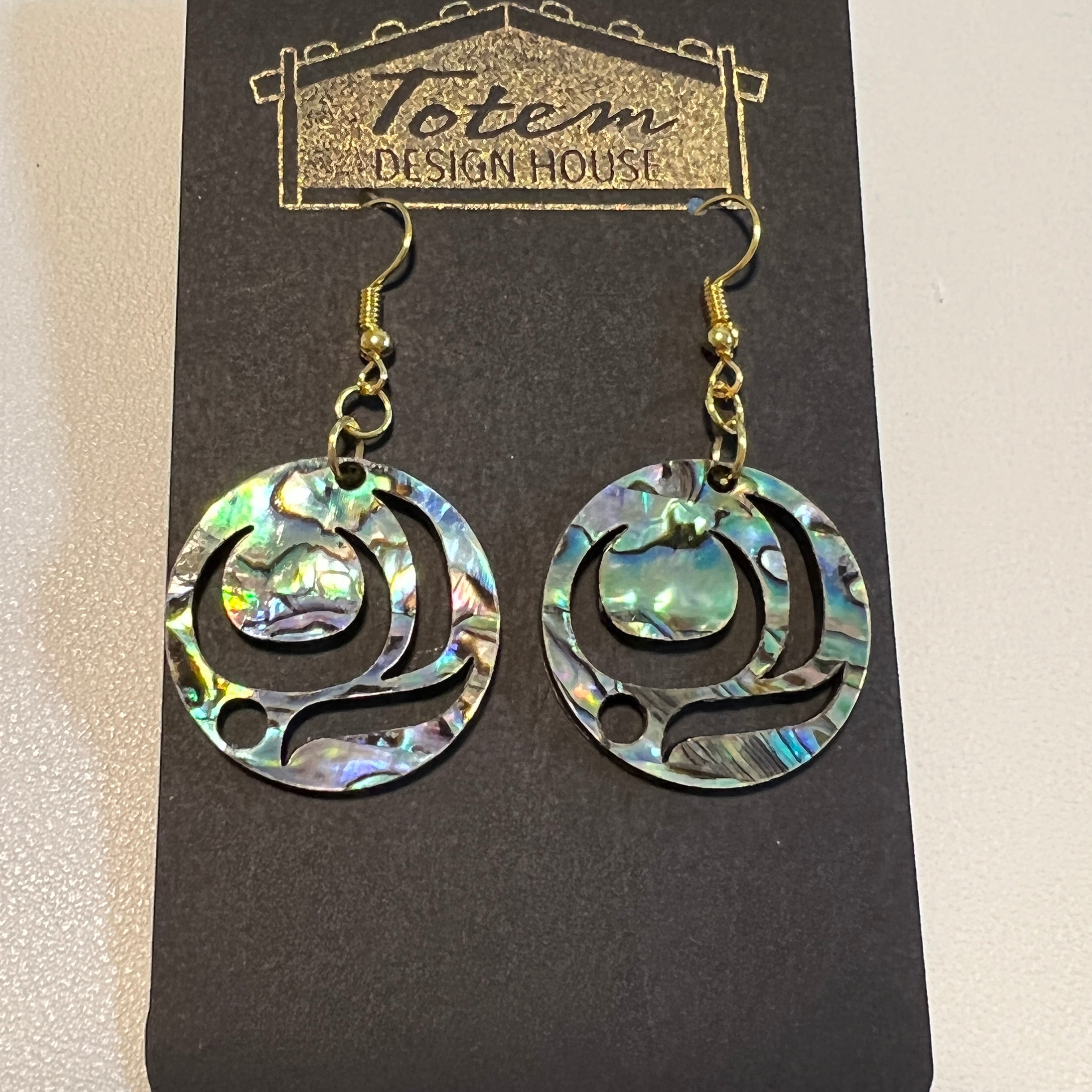 Close up up of salmon trout head earrings by indigenous artist