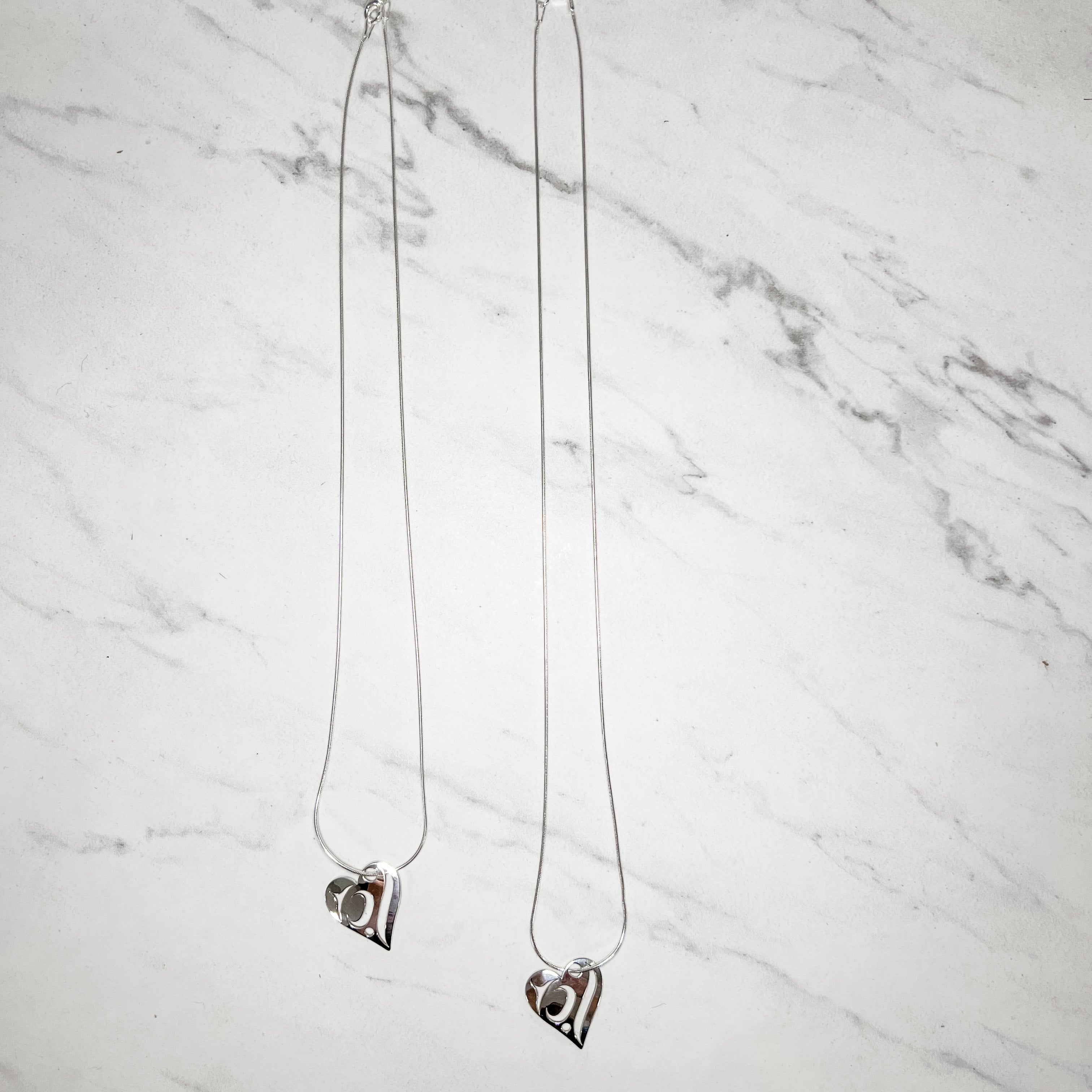 Close up up silver love necklace by indigenous artist 3