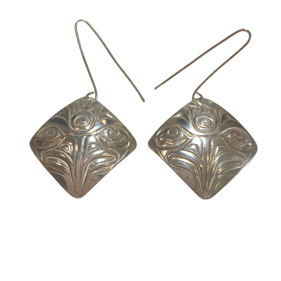 Close up of earrings silver square eagle by indigenous artist