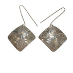 Close up of earrings silver square eagle by indigenous artist