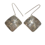 Close up of earrings silver square eagle by indigenous artist