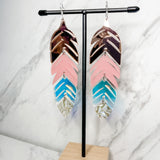 Close up up tiered feather earrings by indigenous artist acrylic 2