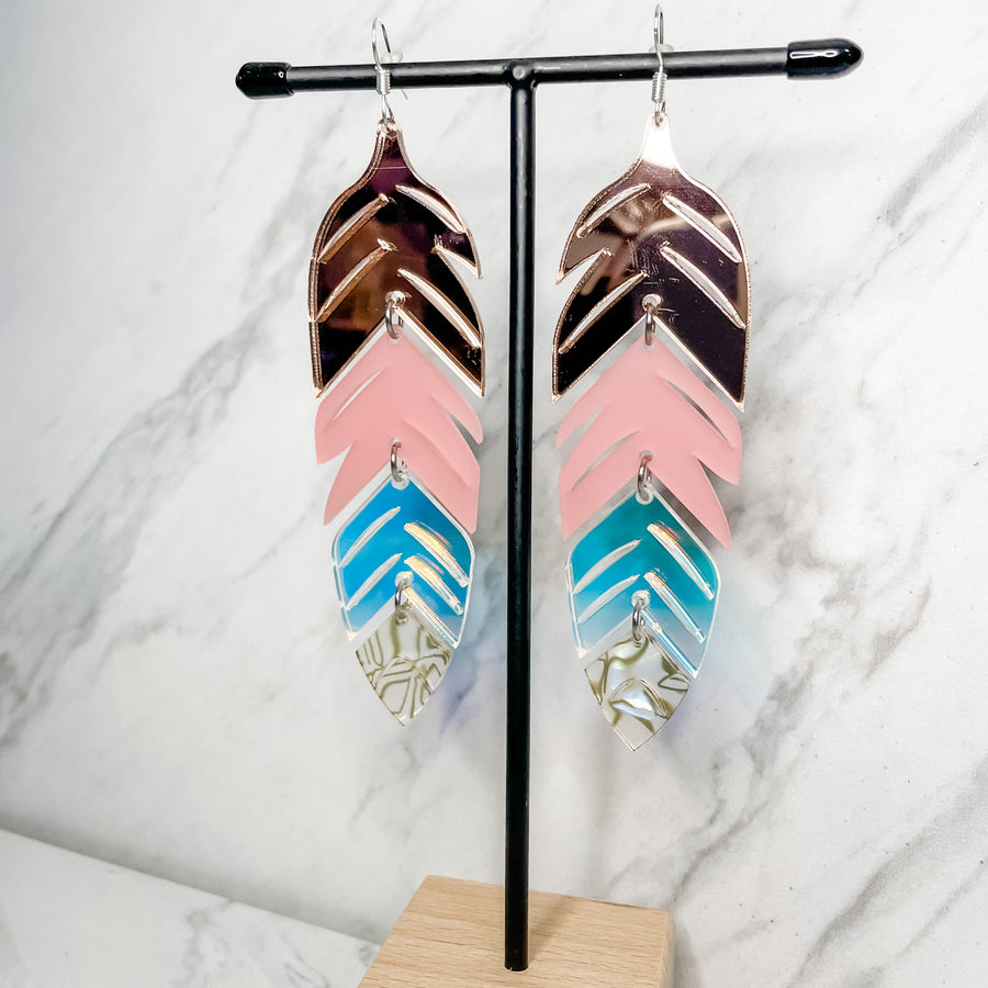 Close up up tiered feather earrings by indigenous artist acrylic 2