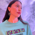 Model wearing salmon trout head earrings by indigenous artist acrylic