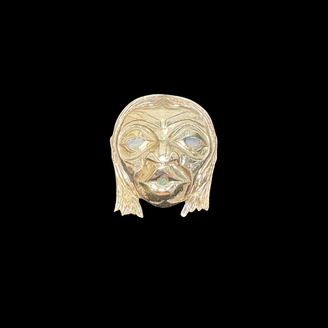 Close up up of wild man pendant by indigenous artist