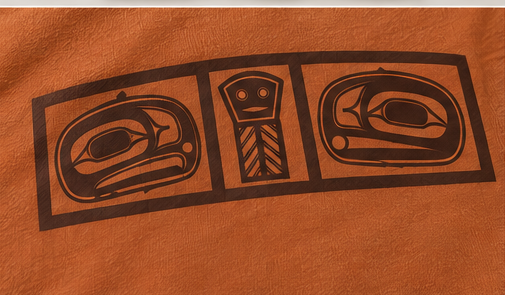 Close-up of the brown ink dowry board print on Texas Orange cotton